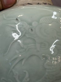 A Chinese celadon-glazed 'dragon' jar with reticulated wooden cover and stand, Qianlong