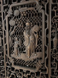 Four Chinese carved and openworked wooden doors, early 20th C.
