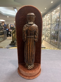 Two carved wooden Corpi Christi and a figure of a monk, Spain and Goa, 16th C.
