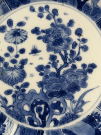 A pair of Chinese lotus-shaped blue and white plates with floral design, yu mark, Kangxi