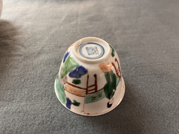 A Chinese famille verte ovoid tea caddy with floral design and a cup with figural design, Kangxi