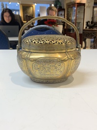 A Chinese bronze 'landscape' handwarmer, Qiu Fuxi 丘福禧 mark, 19th C.