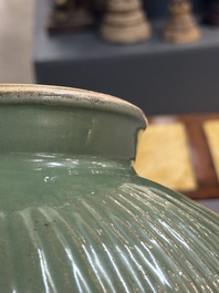 A Chinese Longquan celadon 'lotus' bowl and a large green-glazed jar, Ming and later