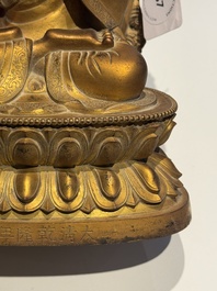 A fine Chinese gilt bronze Buddha, Qianlong mark and of the period