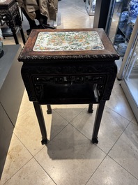A pair of Chinese famille verte 'narrative' plaques mounted in hardwood tables, 19th C.
