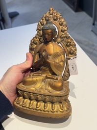 A fine Chinese gilt bronze Buddha, Qianlong mark and of the period