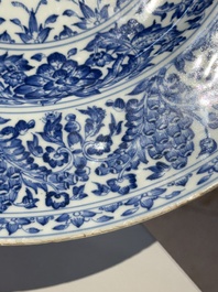 A large Chinese blue and white armorial dish with the arms of the Coelho family, Kangxi