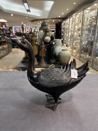 A Chinese bronze duck-form incense burner, Ming