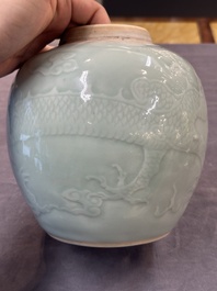 A Chinese celadon-glazed 'dragon' jar with reticulated wooden cover and stand, Qianlong
