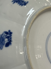 A pair of Chinese lotus-shaped blue and white plates with floral design, yu mark, Kangxi