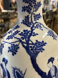 A Chinese blue and white vase with ladies and playing boys in a garden, 19th C.