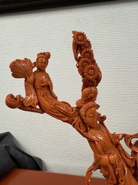 A Chinese red coral group of goddesses on wooden stand, 19/20th C.