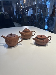Three Chinese Yixing stoneware teapots and covers, 18th C.