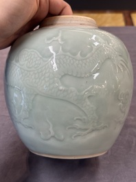 A Chinese celadon-glazed 'dragon' jar with reticulated wooden cover and stand, Qianlong