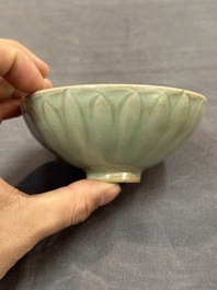 A Chinese Longquan celadon 'lotus' bowl and a large green-glazed jar, Ming and later