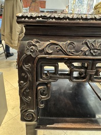 A pair of Chinese famille verte 'narrative' plaques mounted in hardwood tables, 19th C.
