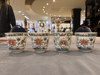 A set of 12 Chinese famille verte cups and saucers with floral design, Kangxi