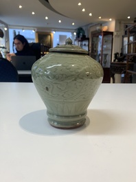 Two Chinese Longquan celadon jars with floral design, Ming
