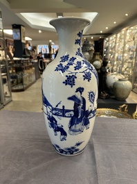 A Chinese blue and white vase with ladies and playing boys in a garden, 19th C.