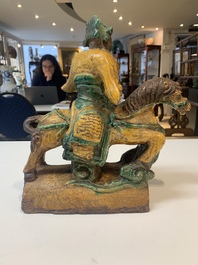 A pair of Chinese sancai-glazed rooftiles, a pair of Buddhist lions and a warrior, Ming and later