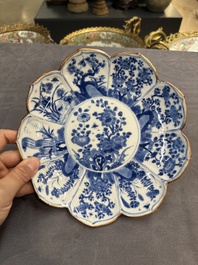 A pair of Chinese lotus-shaped blue and white plates with floral design, yu mark, Kangxi