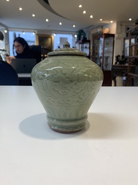 Two Chinese Longquan celadon jars with floral design, Ming