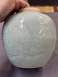 A Chinese celadon-glazed 'dragon' jar with reticulated wooden cover and stand, Qianlong