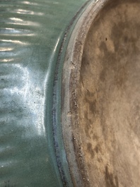 A Chinese Longquan celadon 'lotus' bowl and a large green-glazed jar, Ming and later