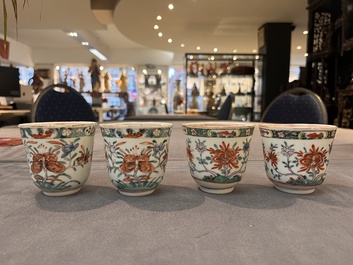 A set of 12 Chinese famille verte cups and saucers with floral design, Kangxi
