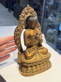 A fine Chinese gilt bronze Buddha, Qianlong mark and of the period