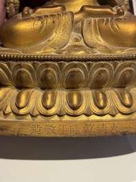 A fine Chinese gilt bronze Buddha, Qianlong mark and of the period