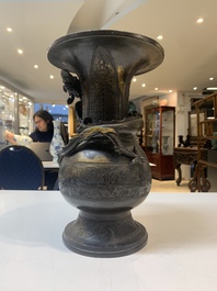 A Chinese archaistic bronze gold-splashed 'dragon' vase, Dong 東 mark, Ming