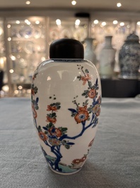 A Chinese famille verte ovoid tea caddy with floral design and a cup with figural design, Kangxi