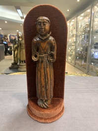 Two carved wooden Corpi Christi and a figure of a monk, Spain and Goa, 16th C.