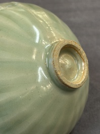 A Chinese Longquan celadon 'lotus' bowl and a large green-glazed jar, Ming and later