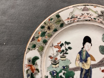 A Chinese famille verte 'lady and playing boy' plate, Kangxi