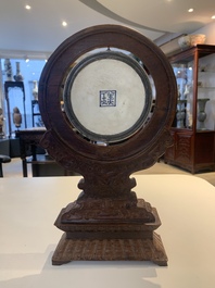 A Chinese blue and white 'Bleu de Hue' 'roosters and chick' plaque in a carved wooden screen and a bowl, 19th C.