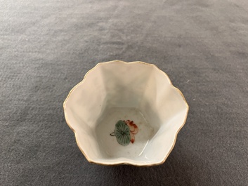A fine Chinese famille verte 'boy and lotus' flower-shaped cup and a wooden stand, Kangxi
