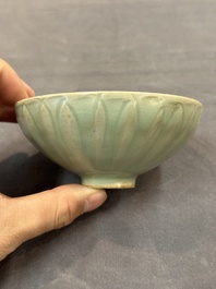 A Chinese Longquan celadon 'lotus' bowl and a large green-glazed jar, Ming and later