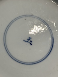 A pair of Chinese lotus-shaped blue and white plates with floral design, yu mark, Kangxi