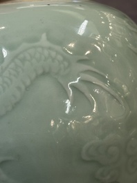 A Chinese celadon-glazed 'dragon' jar with reticulated wooden cover and stand, Qianlong