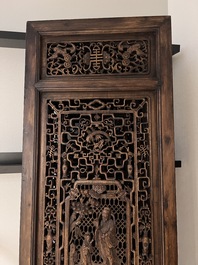 Four Chinese carved and openworked wooden doors, early 20th C.