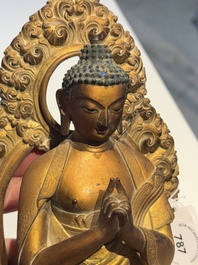 A fine Chinese gilt bronze Buddha, Qianlong mark and of the period