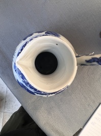 A Chinese blue and white ewer with figures in a landscape, Transitional period