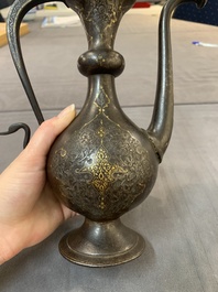 A Persian steel engraved gilt-decorated pear-shaped ewer and cover with floral design, Qajar, 19th C.
