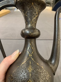 A Persian steel engraved gilt-decorated pear-shaped ewer and cover with floral design, Qajar, 19th C.