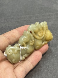 Three Chinese celadon and russet jade carvings of animals, 19th C.