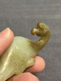 Three Chinese celadon and russet jade carvings of animals, 19th C.
