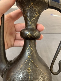 A Persian steel engraved gilt-decorated pear-shaped ewer and cover with floral design, Qajar, 19th C.