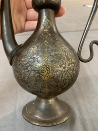 A Persian steel engraved gilt-decorated pear-shaped ewer and cover with floral design, Qajar, 19th C.